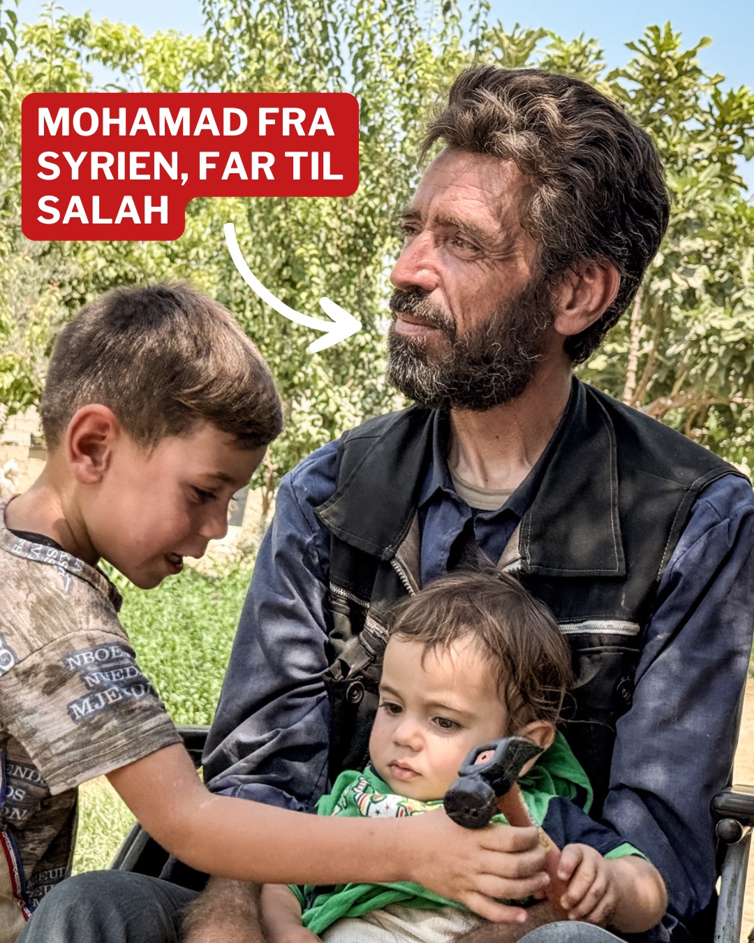 Mohamad from Syria This is Mohamad. He is the father of Salah, who is 8 years old. They live in Syria. He is sitting in a wheelchair with one of his children on his lap.